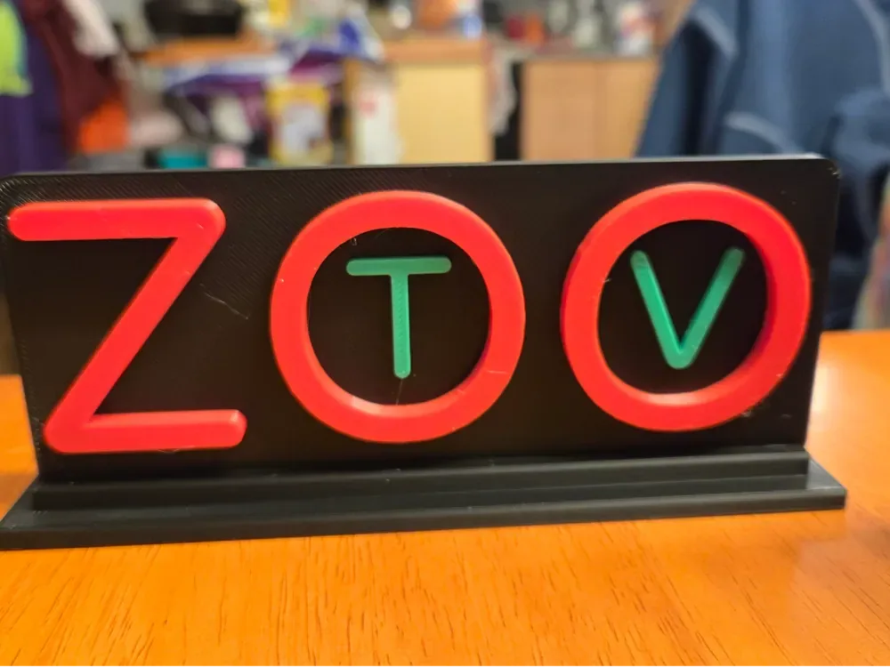 Letrero de escritorio para TV del zoológico U2, vista 1